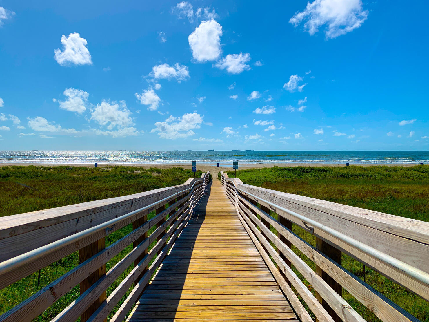BLAZE A TRAIL,Empty boardwalk on field against sky,Galveston,Texas,United States,USA