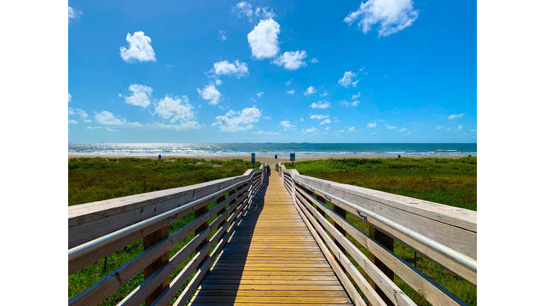 BLAZE A TRAIL,Empty boardwalk on field against sky,Galveston,Texas,United States,USA
