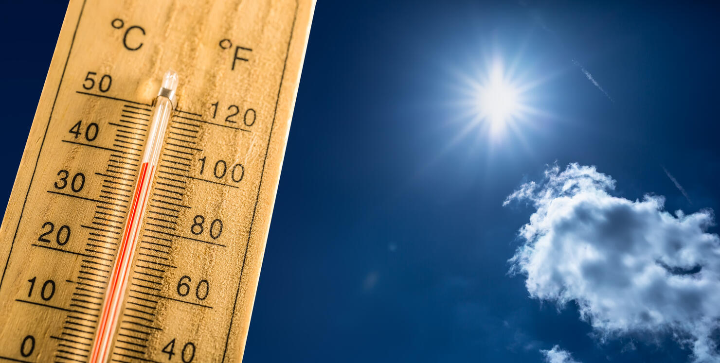 Hot summer day and a hundred fahrenheit on a thermometer.