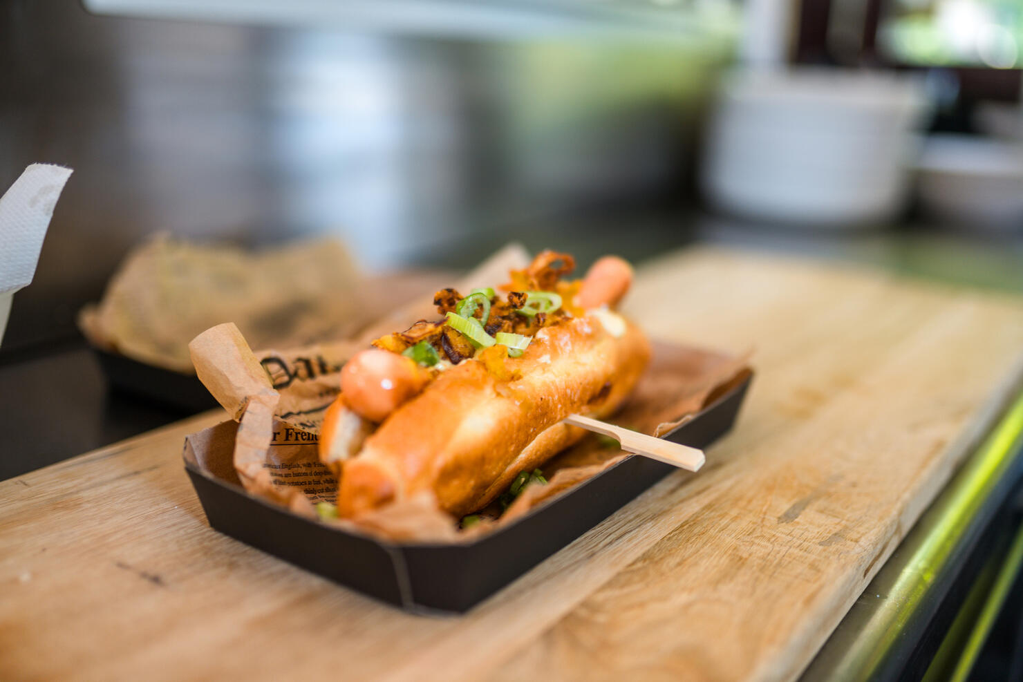 Delicious Hot Dog in a Bun with Spring Onions