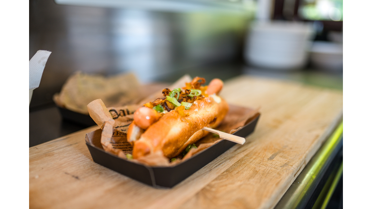 Delicious Hot Dog in a Bun with Spring Onions
