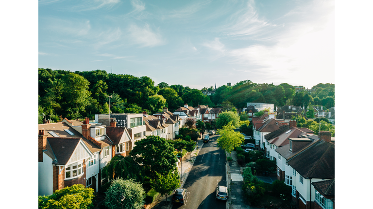 An elevated view of London houses at sunset