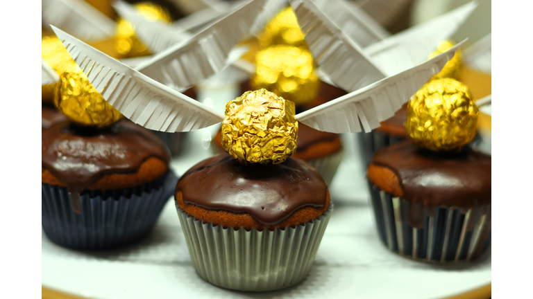 Muffins with snitch (Harry Potter Theme) decoration.