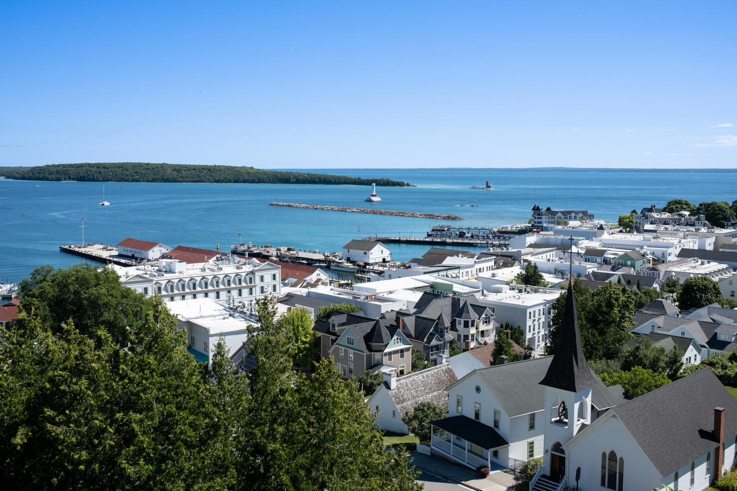 High angle view of townscape by sea against clear blue sky,Mackinac Island,Michigan,United States,USA