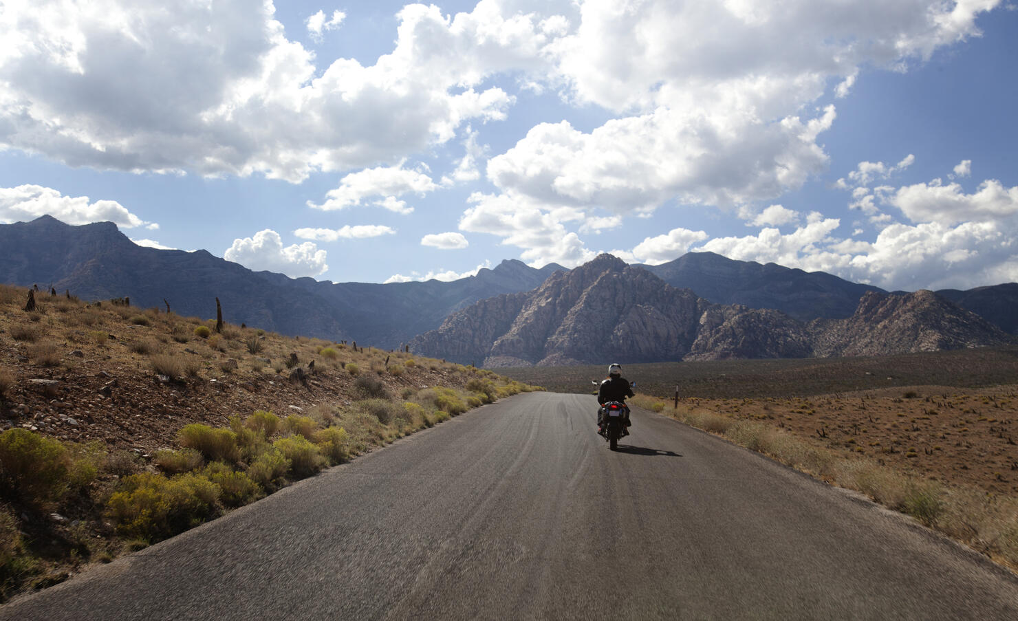 A motorbike rider on an open road