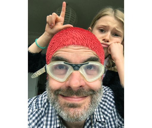 Loser Dad selfie - unimpressed photobomber daugther makes an L sign at father