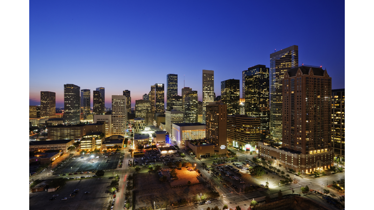 High rise buildings in Houston cityscape illuminated at sunset, Texas, United States