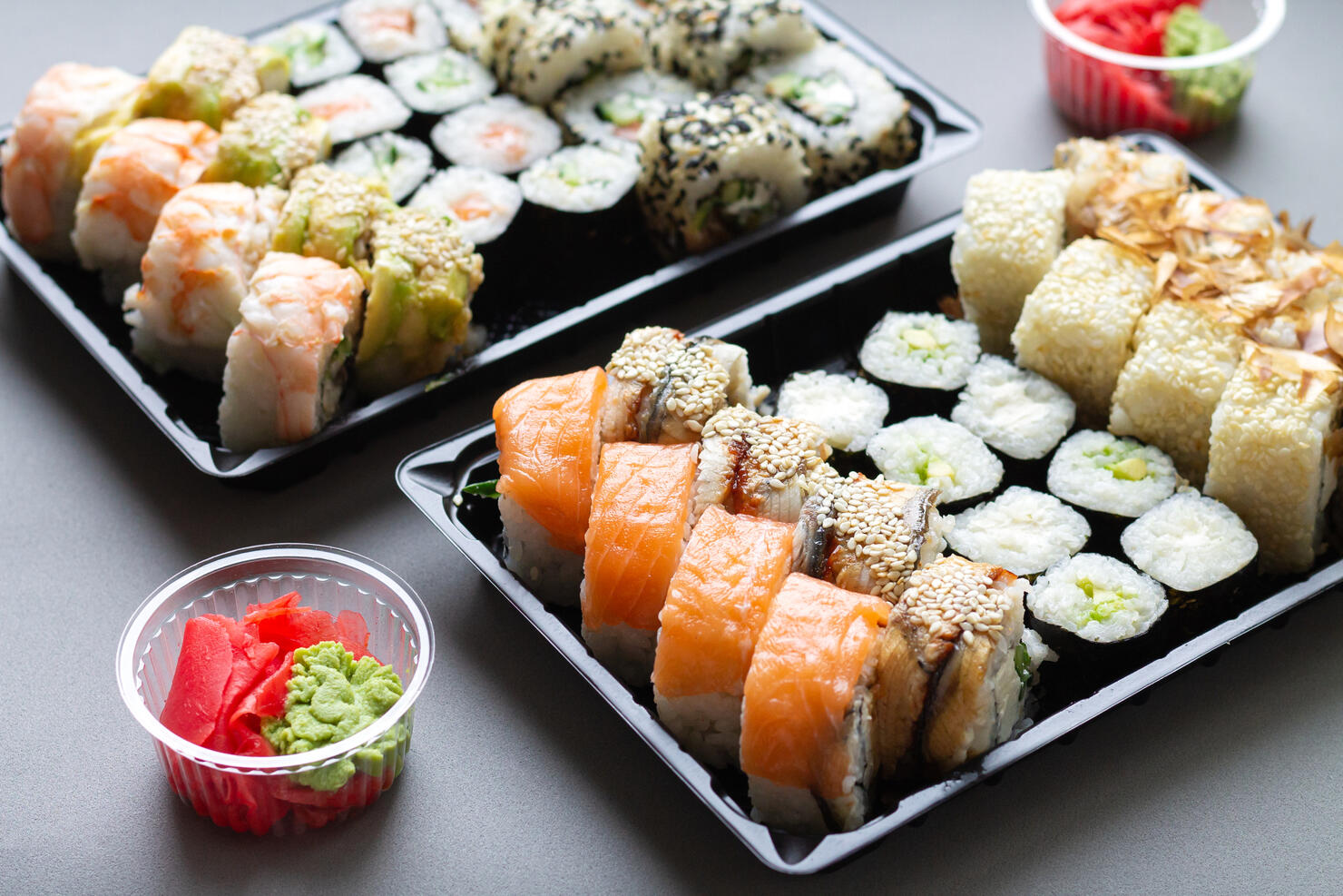 Sushi roll in plastic box for take away background