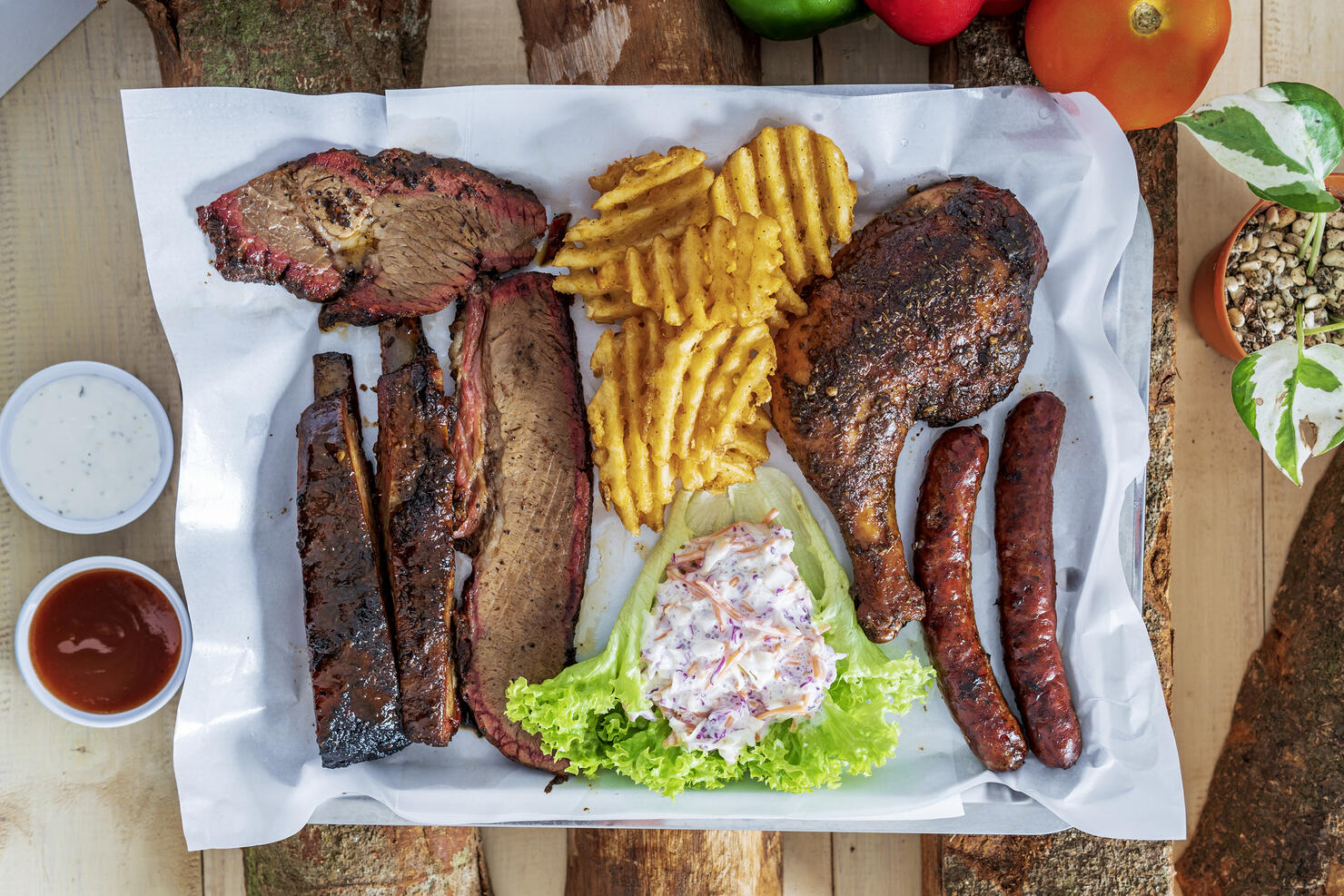 Delicious grilled beef steak and rustic potatoes wedges with vegetable salad served on white plate