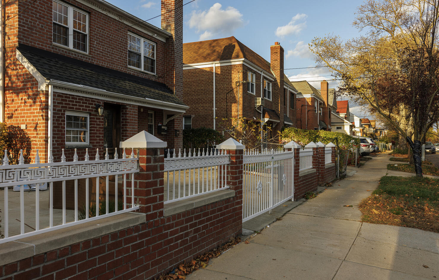 Residential neighborhood in Flushing, Queens, New York City in autumn on a sunny day.