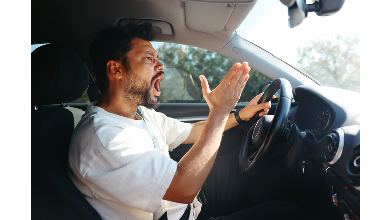 Young man getting angry on the road