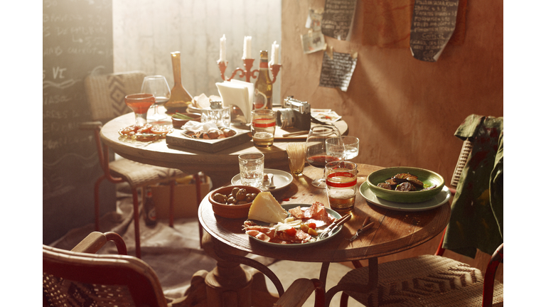 Antipasto starters with olives, chorizo, salami, cheese, parma ham with beer and wine