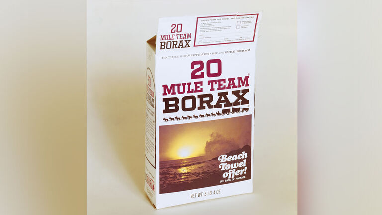 Carton of borax powder on white background, close-up