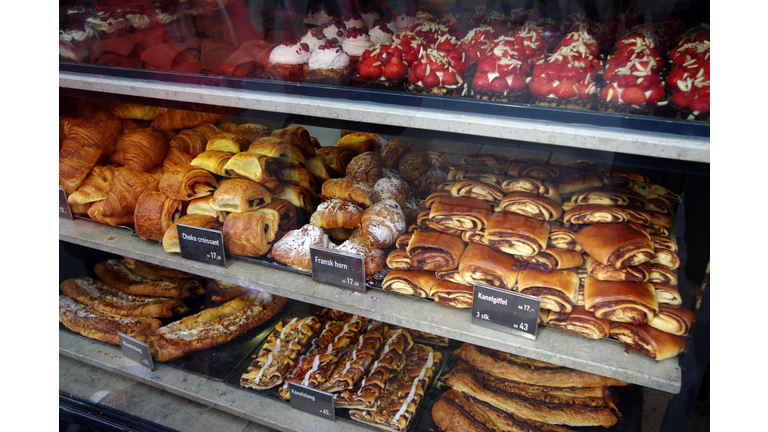 Sweet baked items for sale in the window of a bakery in Copenhagen, Denmark
