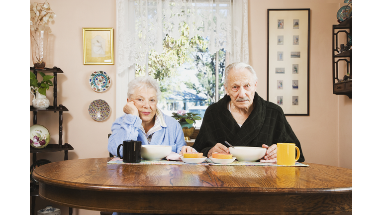 Senior couple at breakfast table