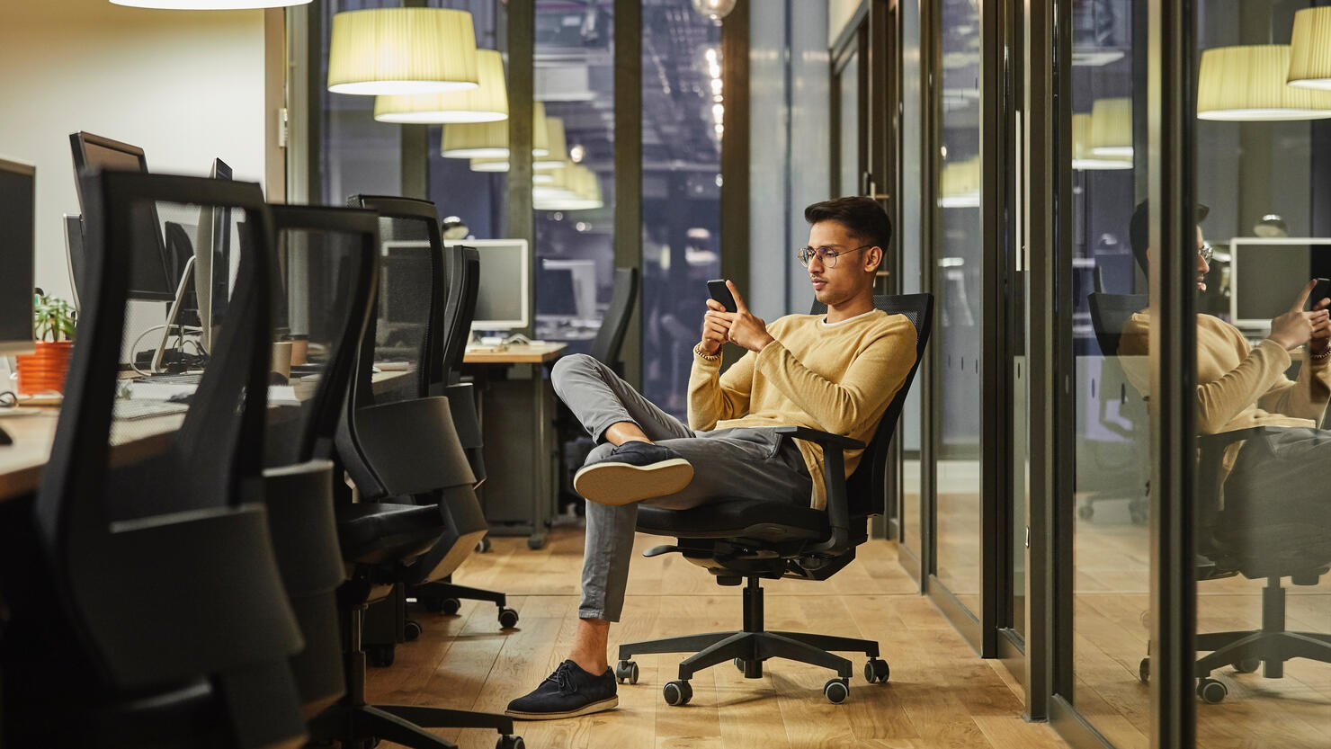 Businessman using smartphone in coworking office