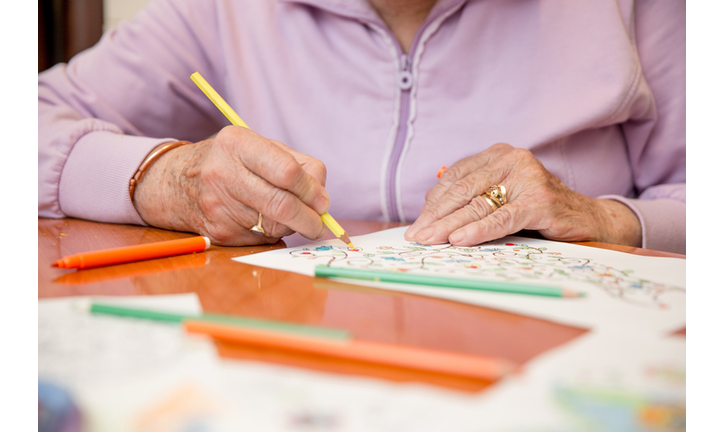 Senior Woman Coloring a Sketch at Home