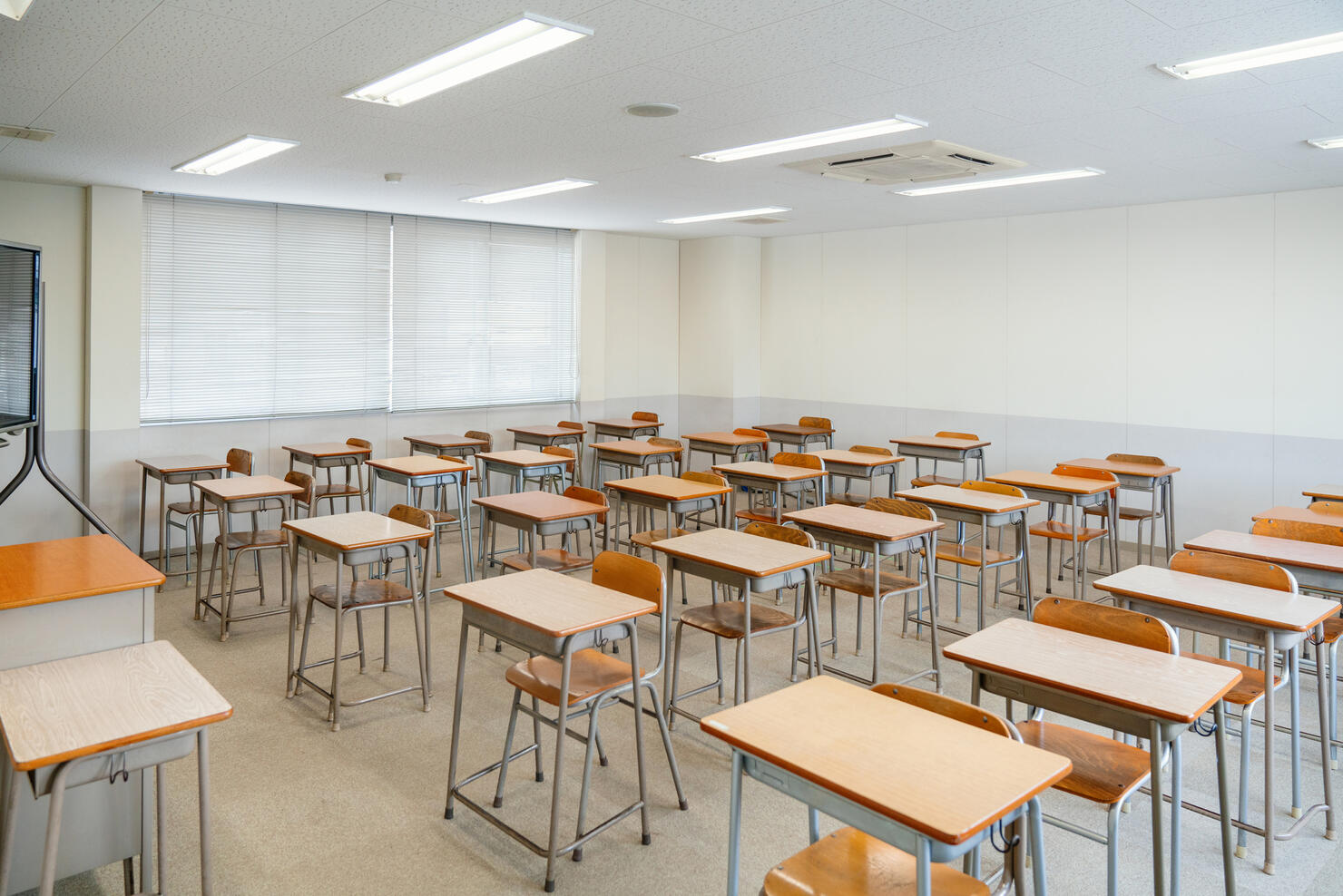 Empty classroom with rows of desks at a community college