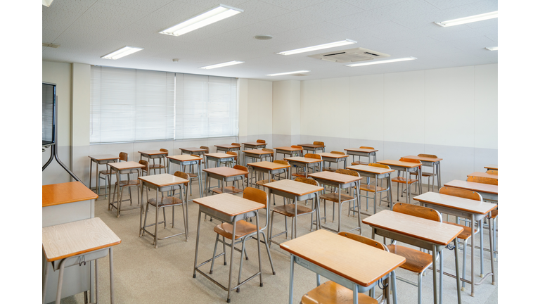 Empty classroom with rows of desks at a community college