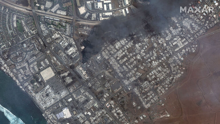 WILDFIRE LAHAINA, MAUI, HAWAII -- AUGUST 9, 2023:  04 Maxar satellite imagery showing total destruction of the Lahaina square and outlets after the Lahaina Wildfire, with one building still actively burning.  Please use: Satellite image (c) 2023 Maxar Tec