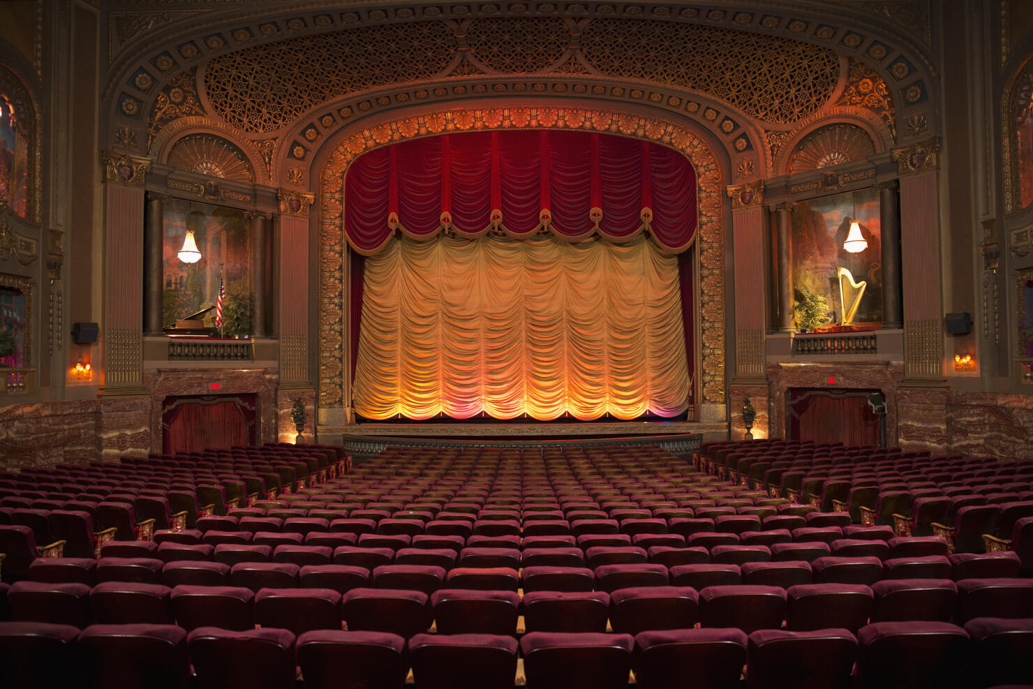 Empty seats in ornate movie theater