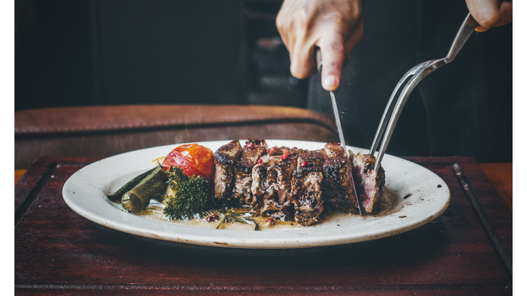 cutting the steak