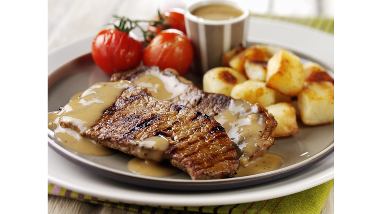 Steak with peppercorn sauce