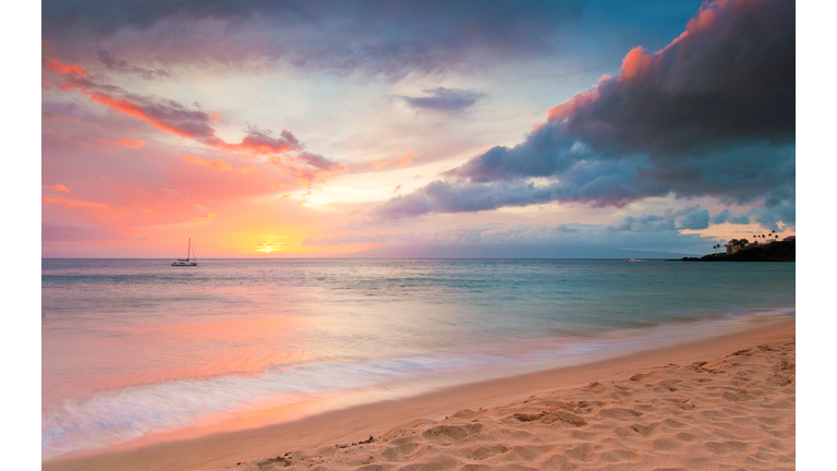 Sunset at beach with boat in distance, Kaanapali, Maui, Hawaii, USA
