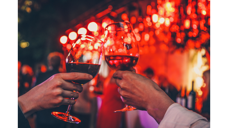 Couple toasting wine glasses