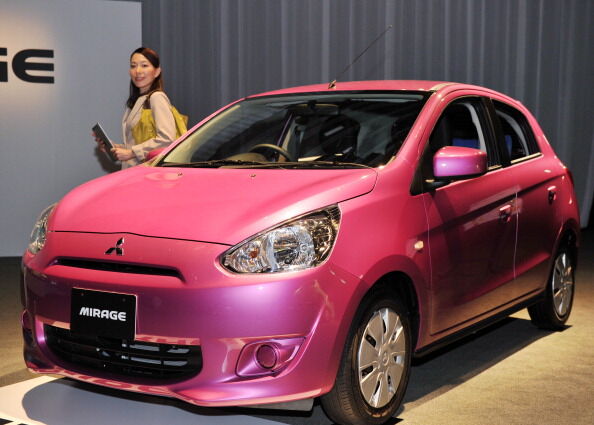 A model poses next to Japan's car manufa