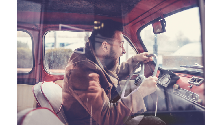 Furious Male Driving Fast with Old Style Car and Screaming