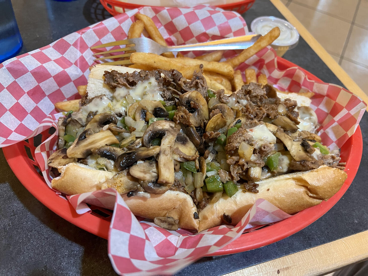 Fresh Philly cheesesteak with mushrooms and diced green peppers