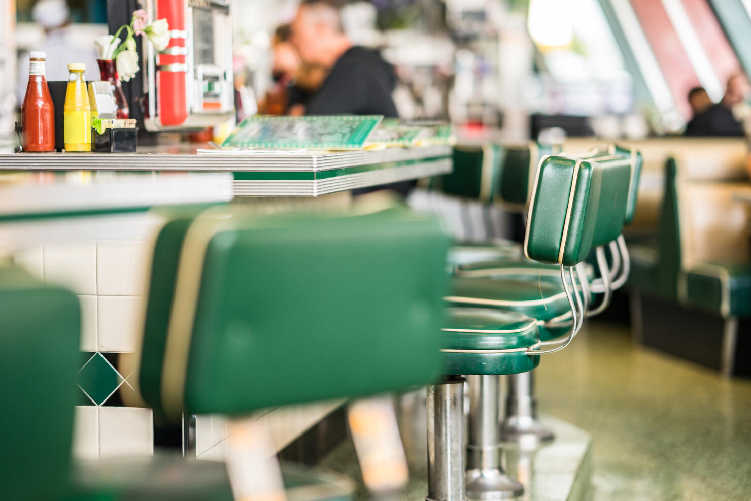 Vintage padded bar stools in an American diner restaurant.