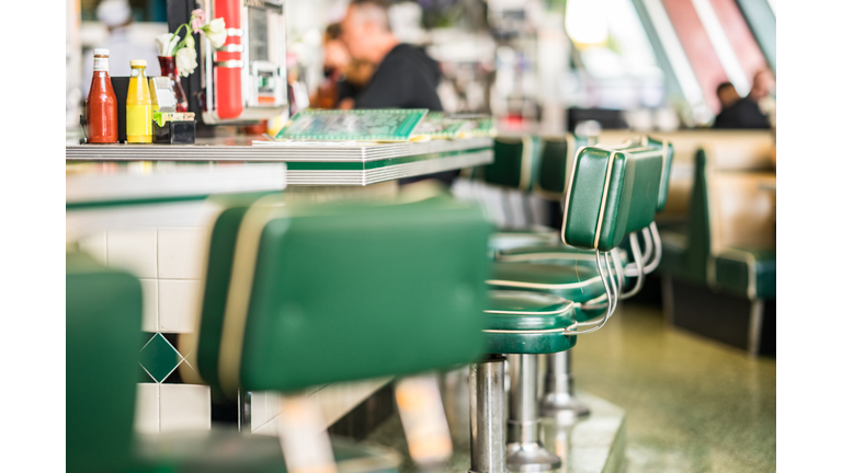 Vintage padded bar stools in an American diner restaurant.
