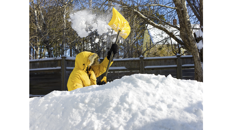 Man Shovelling after a Snow Storm.