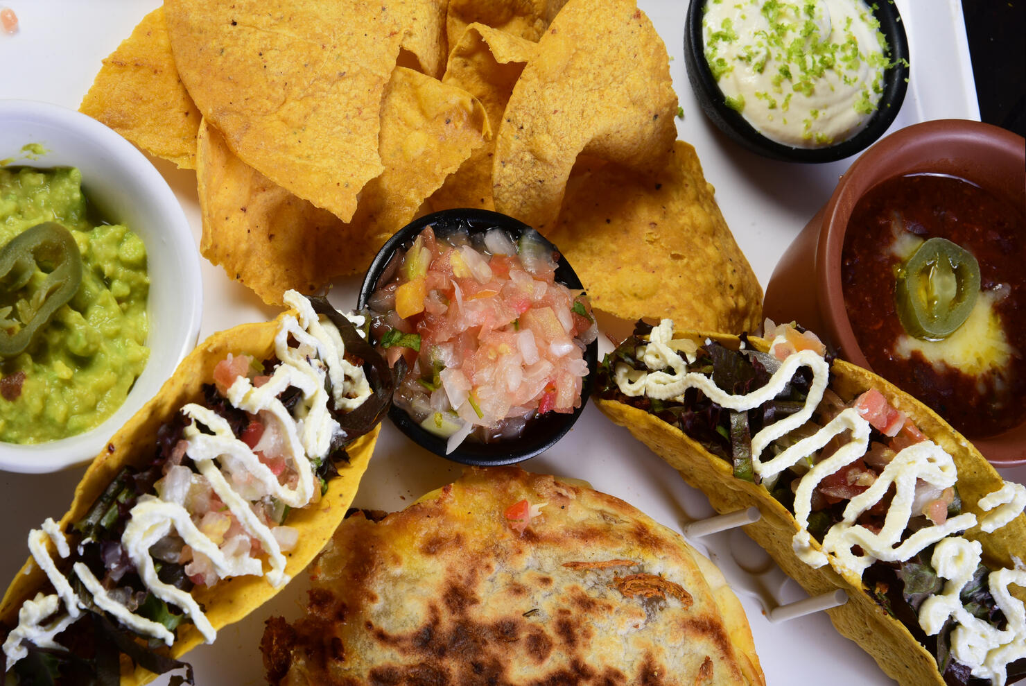 mexican tacos quesadillas and burritos with guacamole chilli salad jalapeno pepper typical tex mex cuisine