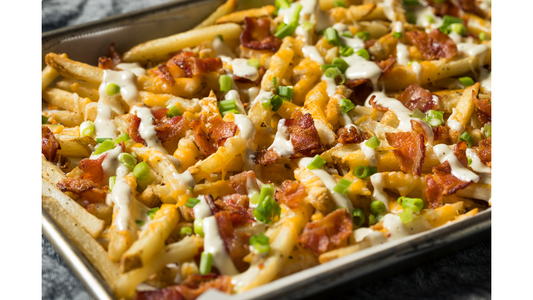 Homemade Bacon Cheddar Ranch Fries,Close-up of pizza in plate on table