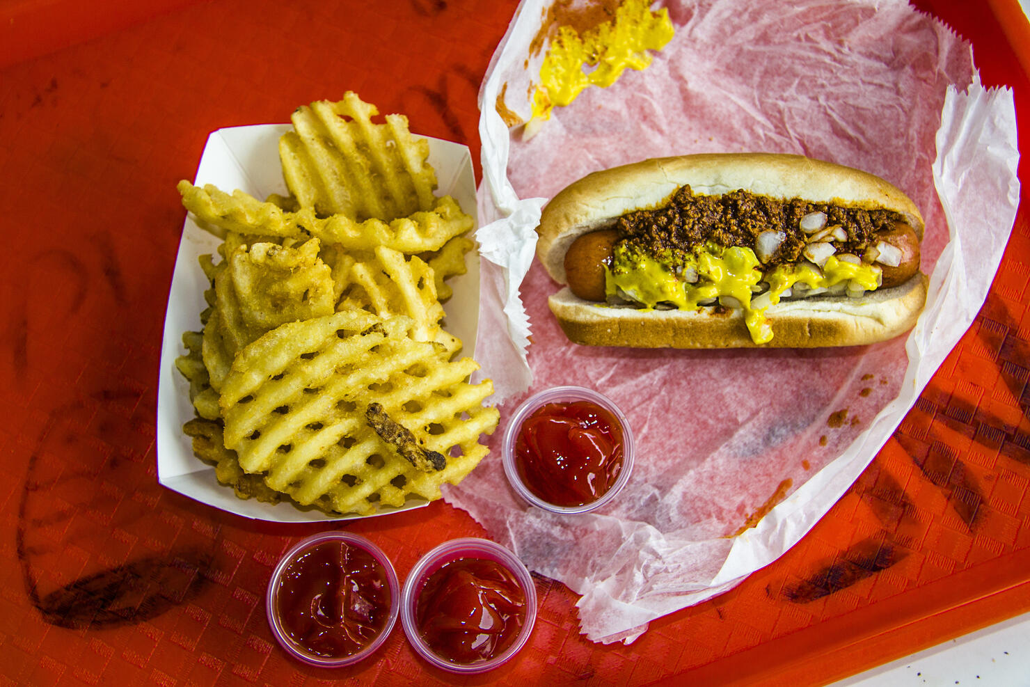 Hot dog and french fries on tray