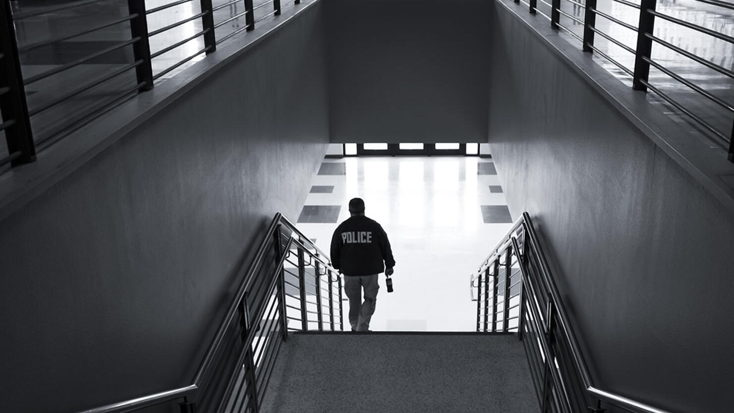 Black and White Photo of a Police Officer