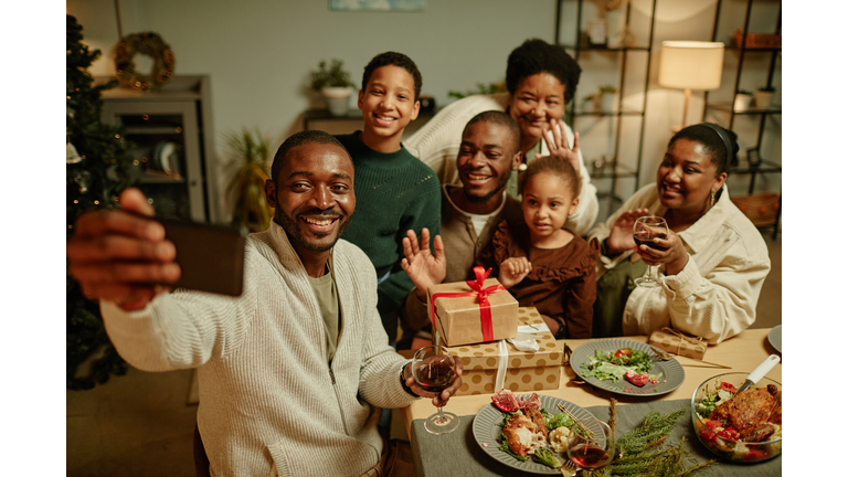 African American Family Taking Selfie at Christmas