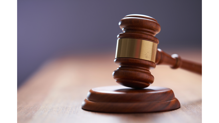 Selective focus on gavel hammer on wooden table top with copy space,Malaysia