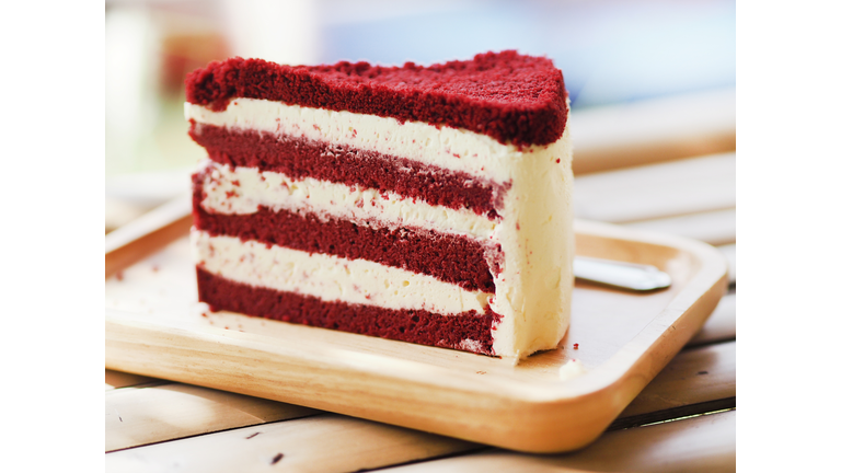 Birthday Cake piece Red Velvet with Whipped Cream on wooden tray
