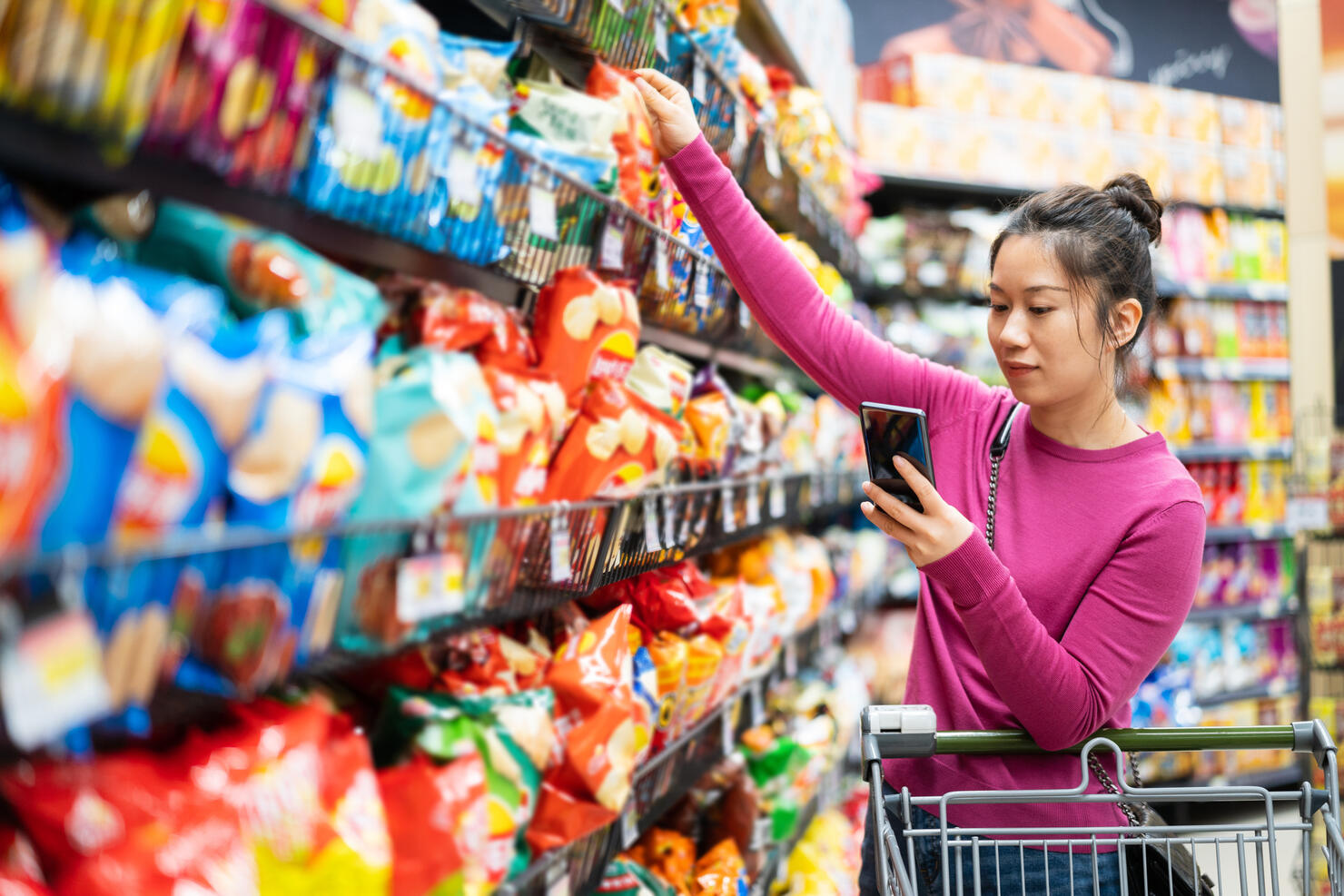 asian female shopping in supermarket