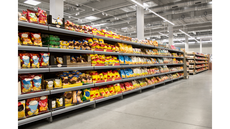 Chips and snacks on shelves in supermarket