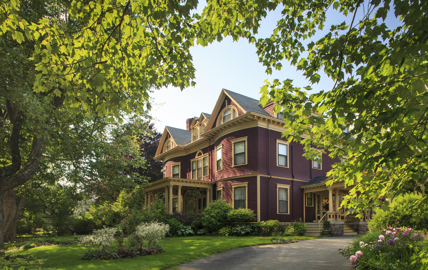 Victorian home surrounded by gardens