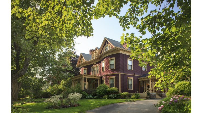 Victorian home surrounded by gardens