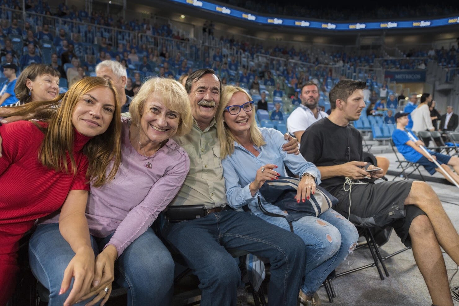 Smiling family sitting in stadium