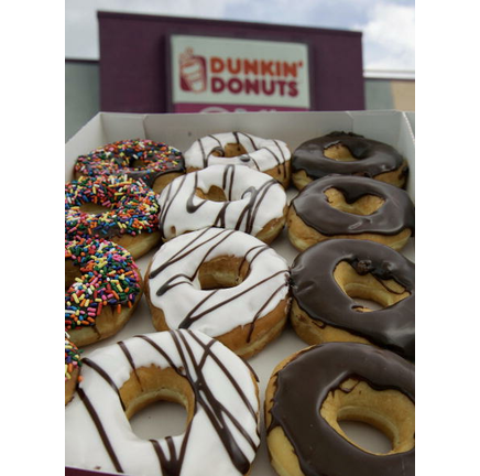 A dozen doughnuts are pictured outside a