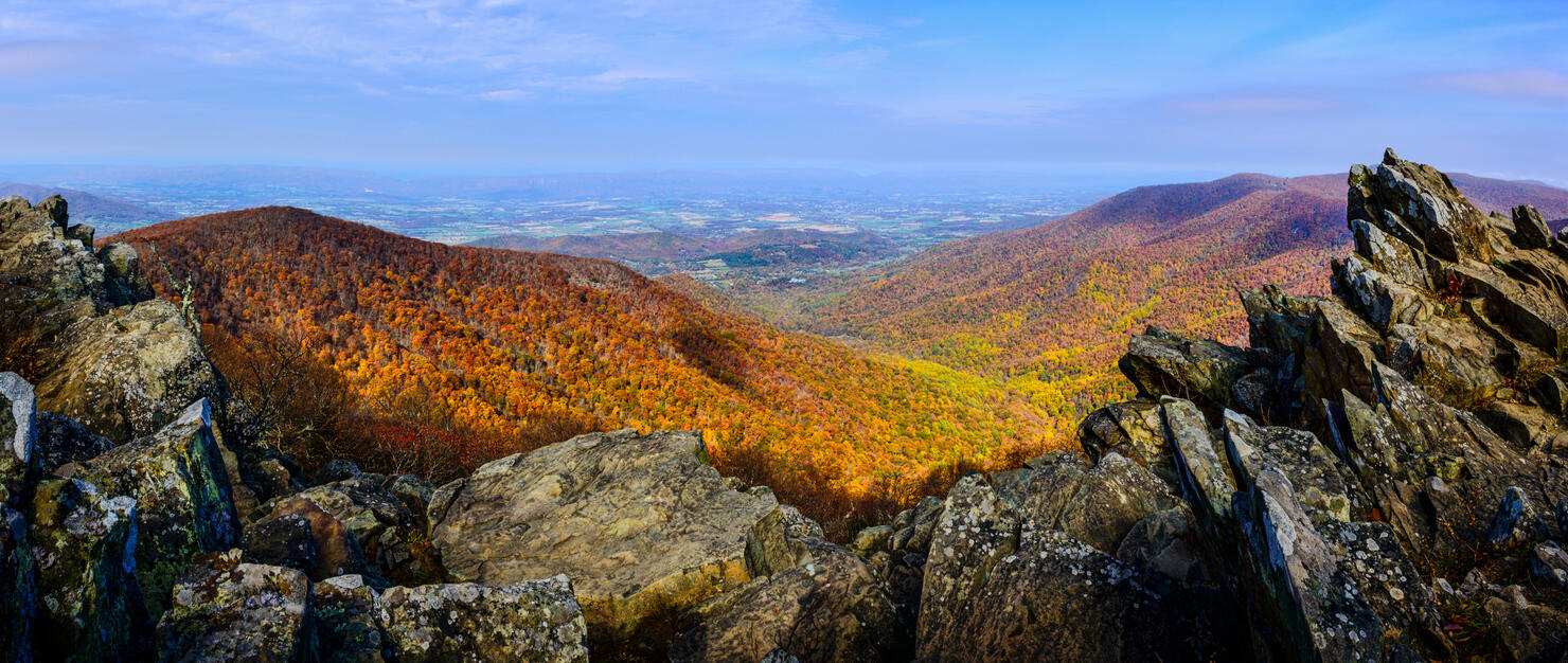 Rock outcroppings frame the autumn forest