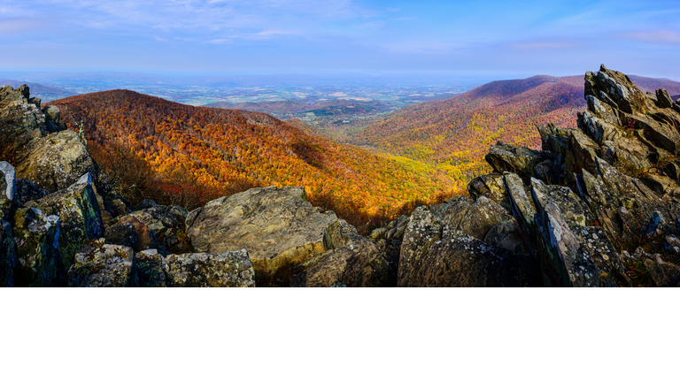 Rock outcroppings frame the autumn forest